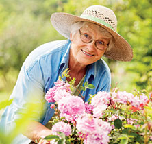 Photo of lady gardening. Links to Gifts of Real Estate page.