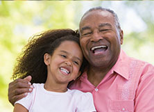 Photo of a man and a child. Links to Ages 60–70 page.