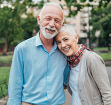 Photo of couple smiling. Links to Gifts from Retirement Plans page.