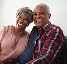 Photo of couple smiling. Links to Gifts by Estate Note page.